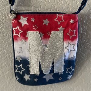 Justice “M” cross body purse.